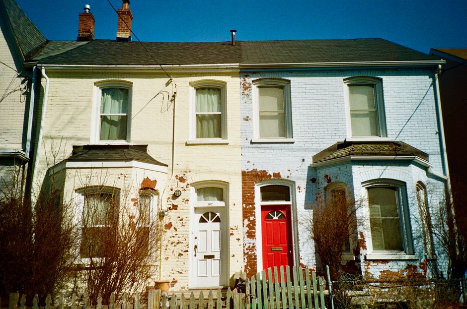 Brick houses with red and white painted doors