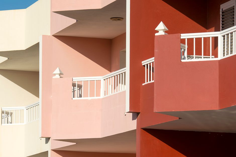 Colorfully painted walls with balconies